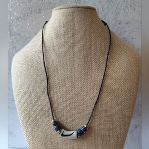 3/$25💙Stylized "swoosh" design pendant necklace on adjustable cord